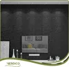 A room interior with a textured black wall, a television, and decorative items. Podgląd zdjęcia produktu