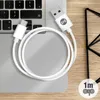 A white USB-A to USB-C cable is coiled on a laptop keyboard. Podgląd zdjęcia produktu
