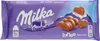 A package of Milka Luflee Alpenmilch chocolate bars with mountains and a cow illustration. Produktbild-Vorschau