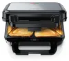 A close-up view of an open sandwich maker with two toasted sandwiches inside. Podgląd zdjęcia produktu