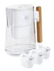 A white water filter pitcher with a wooden handle and three replacement filters. Produktbild-Vorschau