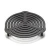 A black cast iron grate with a circular, concentric ring design and three small legs, isolated on a white background. Produktbild-Vorschau