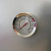 A close-up of a thermometer on a metallic surface. Podgląd zdjęcia produktu