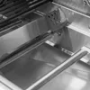 A close-up view of the interior of a gas grill, showing the burners and heat shields. Produktbild-Vorschau