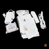 A collection of accessories and documentation for an LG product, including a power adapter, remote control, batteries, and manuals, laid out on a black background. Voir les images du produit