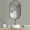 A modern bathroom vanity with a sink, faucet, mirror, and accessories. Produktbild-Vorschau