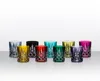 A collection of colorful crystal glasses arranged on a white surface. Produktbild-Vorschau