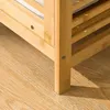 Close-up of the leg and shelf of a wooden laundry basket/shelf unit. Produktbild-Vorschau