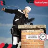 A chimney sweep is cleaning a chimney on a rooftop. Podgląd zdjęcia produktu