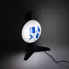 A black gaming headset stand with a circular illuminated light featuring the PlayStation logo. Anteprima dell’immagine prodotto