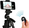 A smartphone is mounted on a tripod, and a remote control is held in a hand. Náhľad obrázku produktu