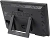 The back of a black digital clock with a stand. Produktbild-Vorschau