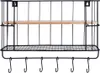 A black metal wall shelf with a wooden shelf and hooks, presented against a white background. Anteprima dell’immagine prodotto