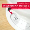 Close-up of a white kitchen scale on a wooden surface, with text overlays highlighting product features. Náhľad obrázku produktu