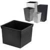 A black plastic planter insert is shown in the foreground, with several other planters of various colors and textures in the background. Náhled obrázku produktu