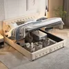 A bed with its storage compartment open, revealing stored items. Produktbild-Vorschau