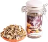 A jar of incense mixture and a pile of the mixture on a small dish, isolated on a white background. Produktbild-Vorschau