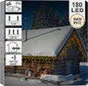 The image shows the packaging for LED string lights, with a winter scene of a snow-covered cabin decorated with the lights. Náhľad obrázku produktu