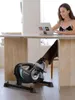 A woman is working on her laptop while using a mini-exercise bike under a desk. Náhľad obrázku produktu