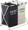 A two-compartment laundry basket with a metal frame. Anteprima dell’immagine prodotto