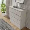 A modern gray dresser with four drawers is shown in a room with a plant and a rug. Produktbild-Vorschau