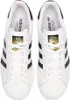 A top-down view of a pair of white Adidas Superstar sneakers with black stripes. Podgląd zdjęcia produktu