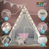 A child's play tent set up indoors, decorated with lights and pillows, with various features highlighted by callouts. Produktbild-Vorschau