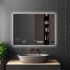A modern bathroom with a smart mirror, sink, and plant. Produktbild-Vorschau