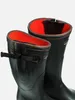 A close-up shot of two black rubber boots with orange lining. Produktbild-Vorschau