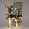 A lighted reindeer decoration is shown in front of a mirror, creating an infinity effect. Anteprima dell’immagine prodotto