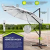 A large, white cantilever umbrella is shown with various measurements and feature callouts. The background includes a blurred outdoor scene with grass and a wooden deck. Voir les images du produit