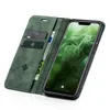 A green flip case for a smartphone, showing the inside with card slots and a phone displaying a green wallpaper. Produktbild-Vorschau