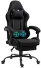 A black gaming chair with a footrest and headrest, shown from a three-quarter view against a white background.