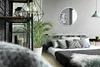A bedroom scene with a bed, plants, and decorative items. Produktbild-Vorschau