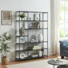 A black metal bookshelf filled with decorative items and books, placed in a living room setting next to a window and a blue sofa. Náhled obrázku produktu