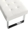A close-up view of a white tufted bench with a chrome metal leg. Produktbild-Vorschau