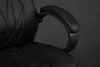 A close-up shot of the armrest and seat of a black gaming chair. Produktbild-Vorschau