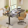 A modern home office setup with a standing desk, monitors, laptop, and a comfortable chair. Náhled obrázku produktu