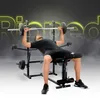 A man is performing a bench press on a weight bench. The background is dark with glowing yellow text and smoke effects. Produktbild-Vorschau
