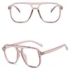 Two views of a pair of pink eyeglasses on a white background. Náhled obrázku produktu