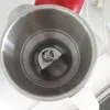A close-up view of the inside of a blender jug, showing the blades. Voir les images du produit
