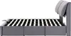 Side view of a grey bed frame with a slatted base. Produktbild-Vorschau