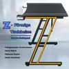A black gaming desk with a Z-shaped frame highlighted in yellow, with text overlays describing its features. Produktbild-Vorschau