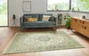 A living room scene with a sofa, rug, and cabinet. Produktbild-Vorschau