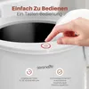 A hand is pressing a button on a white appliance, with text overlays describing its features. Podgląd zdjęcia produktu