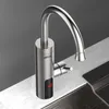 A modern kitchen faucet with a digital display is shown on a countertop next to a sink. Podgląd zdjęcia produktu