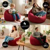 A collage of four images showing different sizes of Lumaland Sitzsack Comfort beanbags with people using them. Voir les images du produit