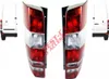 A pair of red and white car taillights are shown against a white background. Small images of a white van are visible on either side. Voir les images du produit