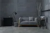 A modern living room setting with a gray sofa, a black cabinet, a floor lamp, and a decorative tree. Podgląd zdjęcia produktu