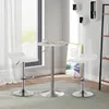 A modern bar set with two white bar stools and a round table in a bright room. Produktbild-Vorschau